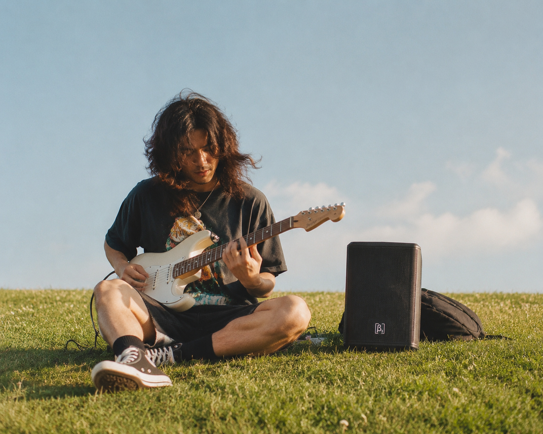Street musician using a battery-powered portable PA for busking